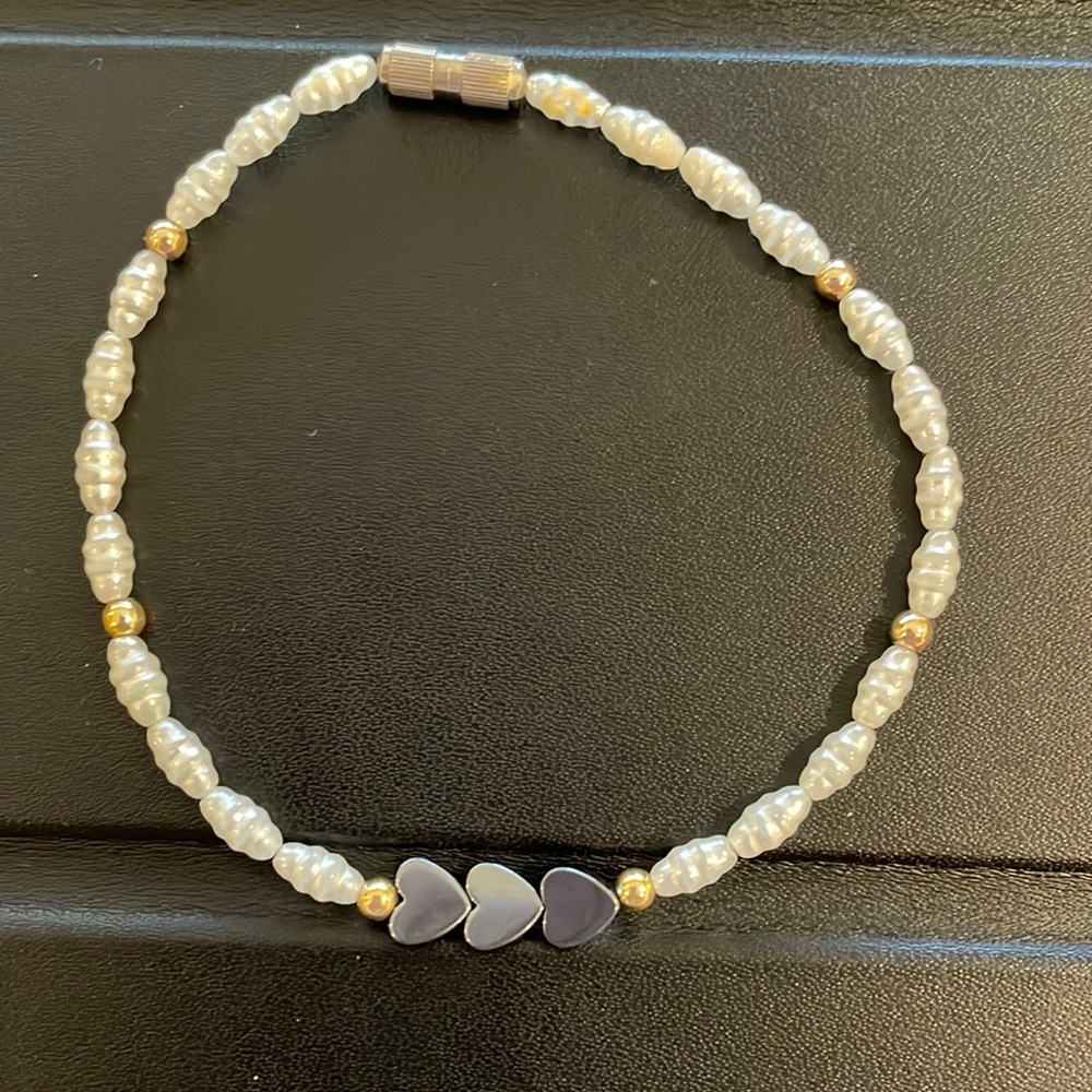 Costume fresh water pearls with faux gold balls and hearts.